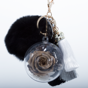 GOLD PRESERVED ROSE | BLACK FLUFFY BALL WITH FADED BLACK THREAD TASSELS KEYCHAIN